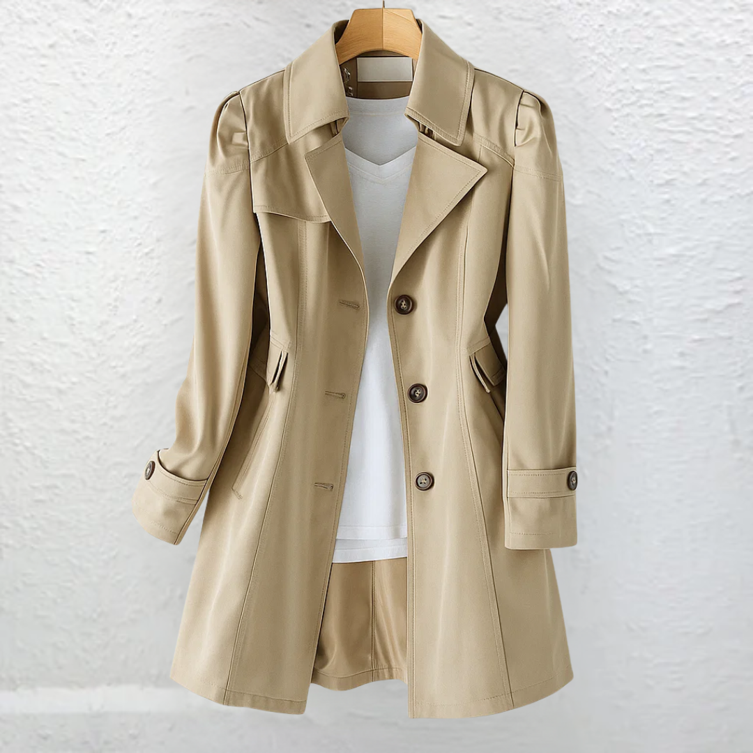 Classic ladies' trench coat, structured with a belt for an elegant, vintage-style look. Perfect fall outerwear.