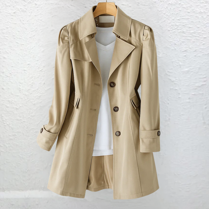Classic ladies' trench coat, structured with a belt for an elegant, vintage-style look. Perfect fall outerwear.