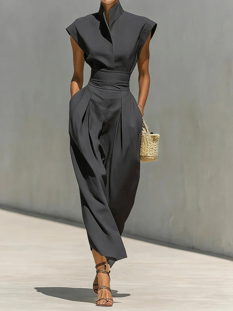 Stylish women's structured midi dress, featuring a cinched waist and long sleeves for an elegant, modern look.