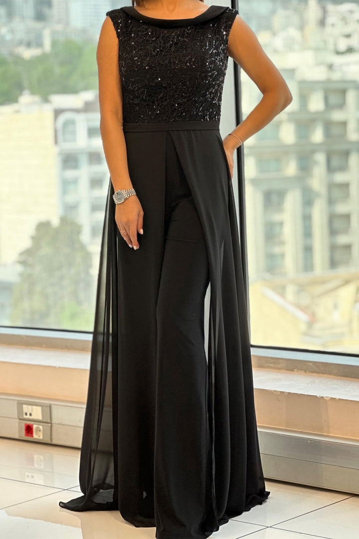 Elegant women's textured-panel jumpsuit with crew neck, perfect for versatile modern style. One-piece outfit.