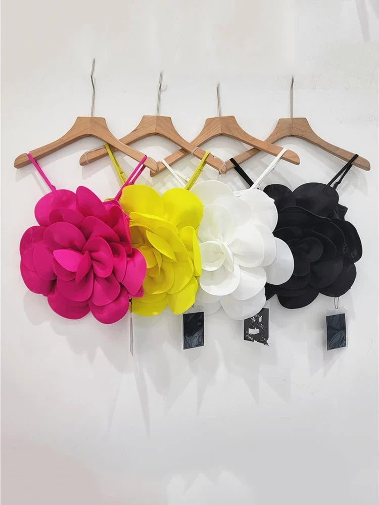 Detailed 3D floral embellished top for women. A vibrant and elegant statement piece for modern spring fashion.