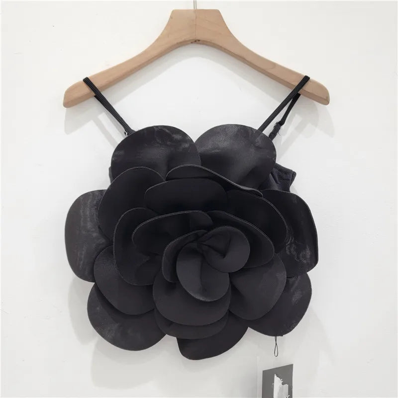 Elegant women's top showcasing beautiful 3D flowers. A chic apparel choice for sophisticated spring/summer style.