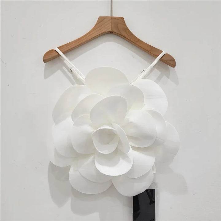 Bold statement women's top featuring luxurious 3D floral embellishments. Perfect for elegant spring fashion.