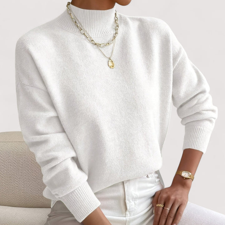 Elegant women's turtleneck sweater in a comfortable knit, perfect for chic fall & winter fashion. Long sleeve pullover.