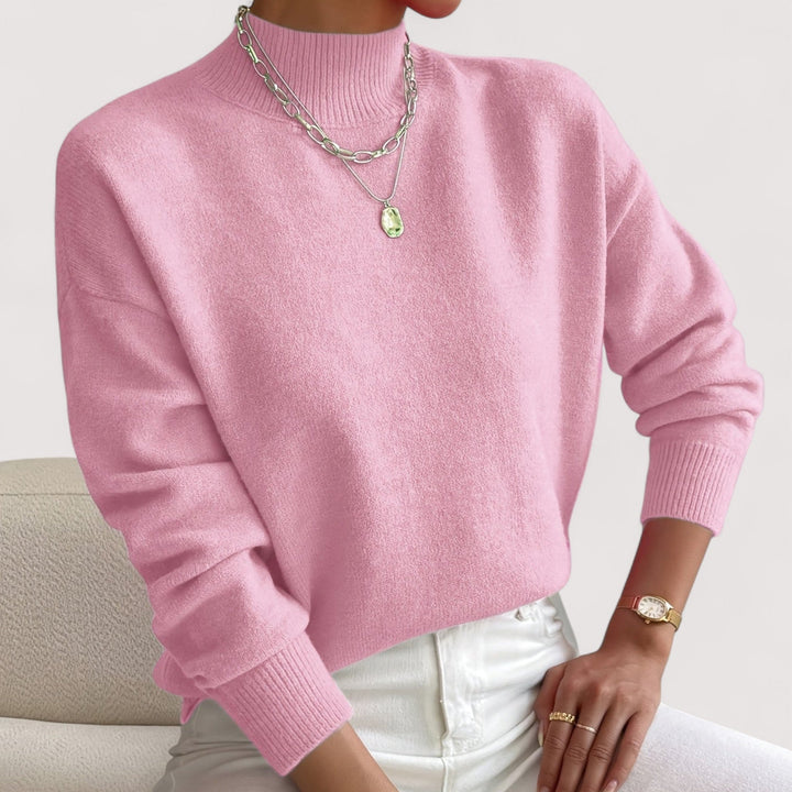 Cozy women's turtleneck knit sweater, ideal for warm winter fashion. Elegant long sleeve pullover top.