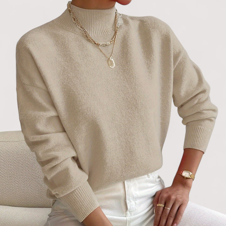 Soft knit women's turtleneck sweater, a comfortable & elegant long sleeve pullover for cozy fall/winter wear.