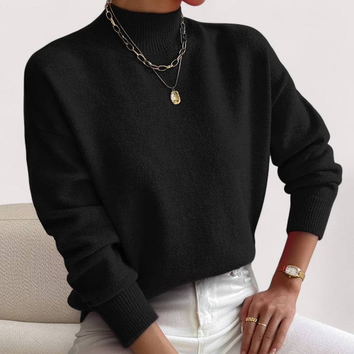 Stylish women's turtleneck sweater, an elegant fall/winter apparel top. Comfortable long sleeve knit pullover.