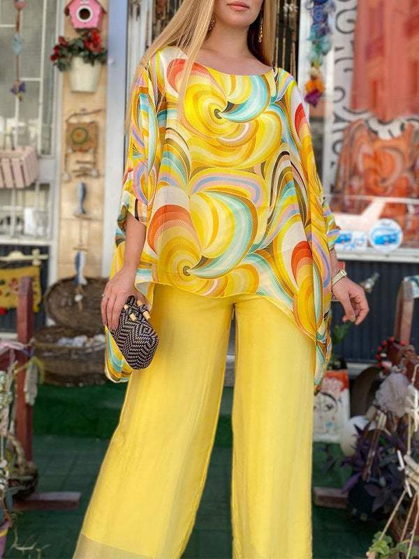 Flowy swirl print top and wide leg pants set for women, ideal resort wear and elegant vacation outfit.