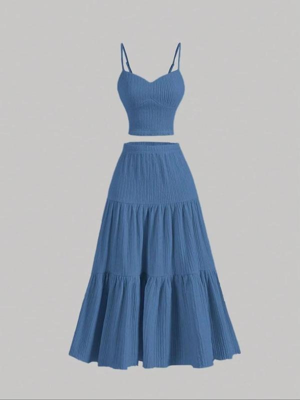 Comfortable women's matching skirt set, a chic cami top & midi skirt for elevated spring/summer fashion.