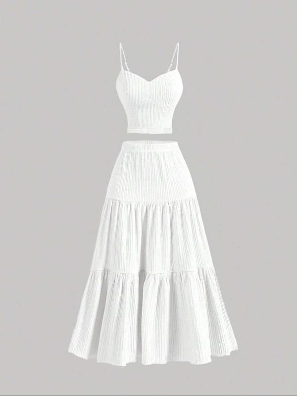 Women's stylish two-piece outfit featuring a cami top and midi skirt, ideal for casual chic or elegant attire.