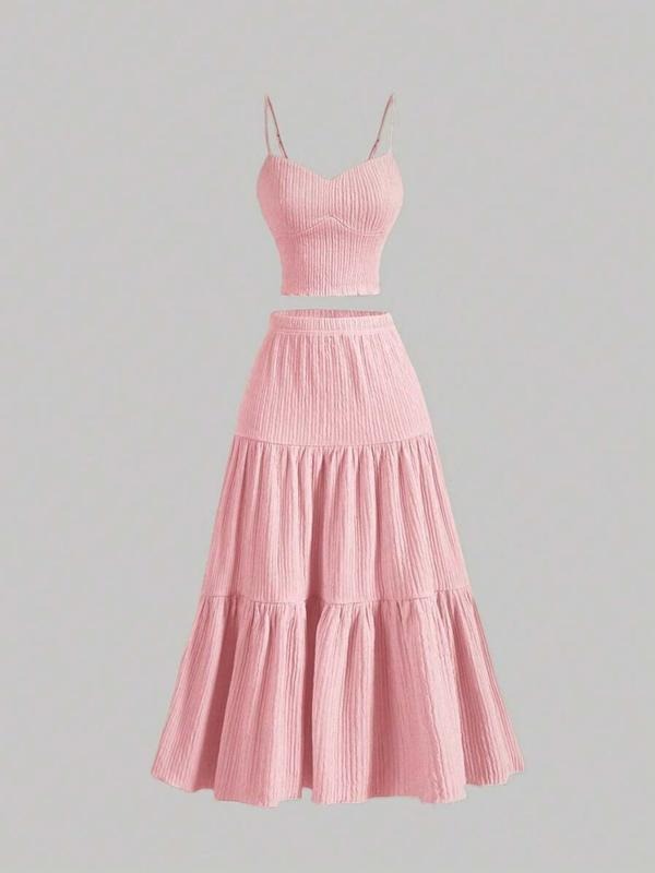 Modern women's matching skirt set, an elegant cami top & midi skirt creating a sophisticated two-piece outfit.