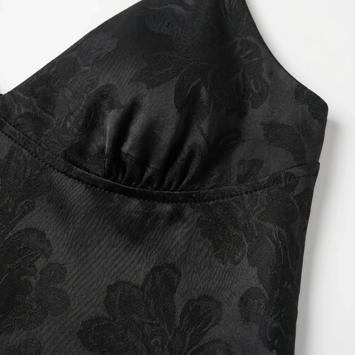 Chic V-neck spaghetti strap cami for women. This elegant cropped top features a subtle floral jacquard design, great for summer.