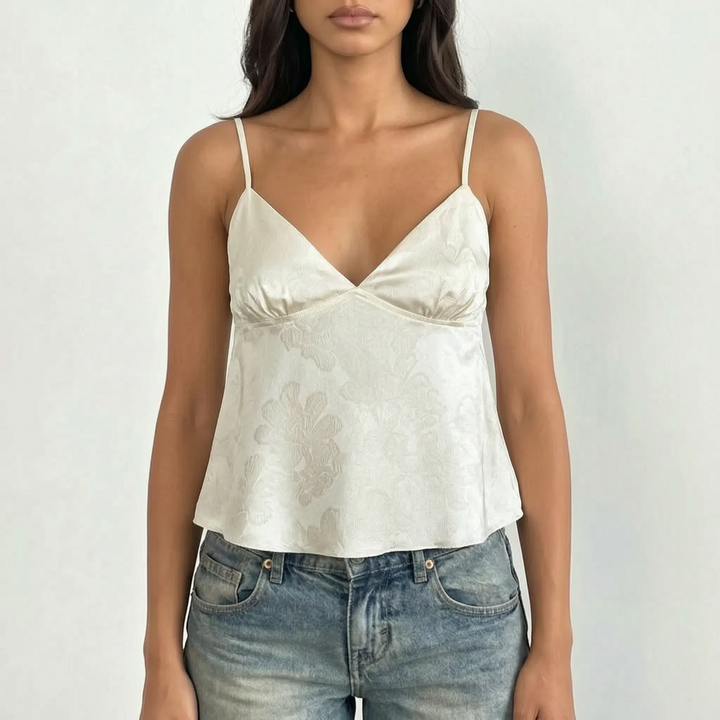 Comfortable & elegant women's V-neck camisole. Cropped design with floral jacquard fabric & spaghetti straps, perfect for summer.