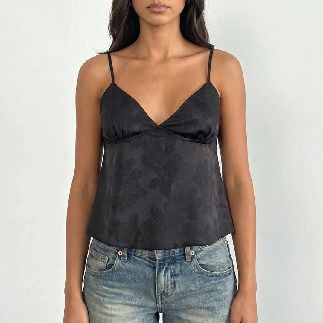 Modern women's V-neck cami top. This elegant floral jacquard cropped camisole with spaghetti straps is ideal for summer fashion.