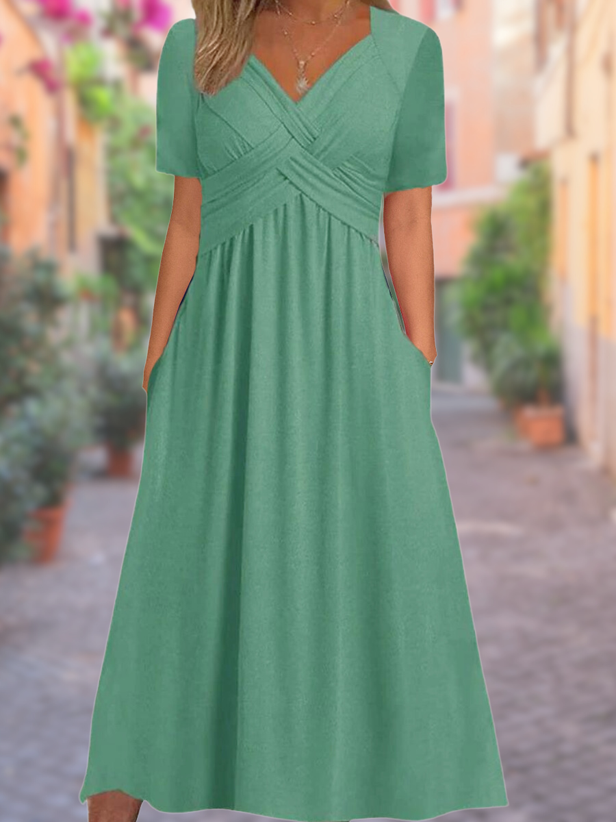Chic sleeveless V-neck midi dress for women, featuring a unique crisscross design, ideal for evening wear.