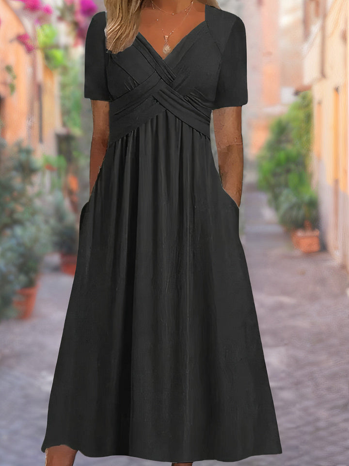 Sophisticated women's V-neck midi dress, sleeveless with a striking crisscross front, perfect for spring/summer.