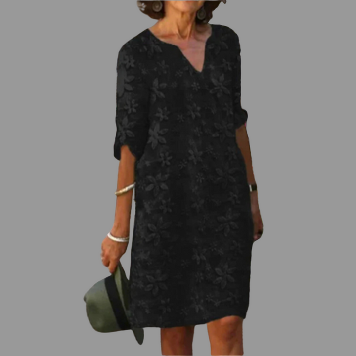 Stylish women's floral midi dress with V-neckline, flattering fit for a chic casual or elegant spring outfit.