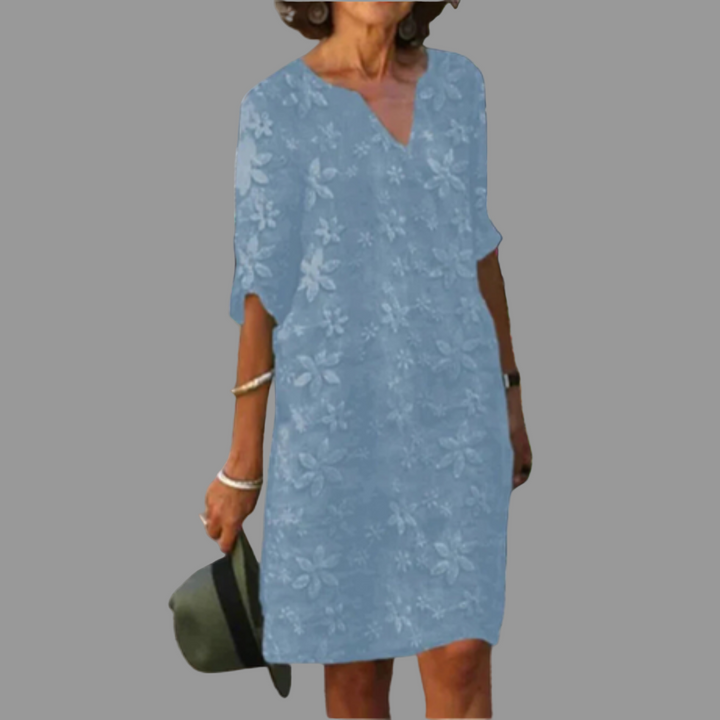 Vibrant floral print midi dress for women, featuring a flattering V-neck, embodying spring and summer elegance.