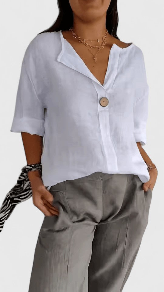 Stylish women's V-neck top with a trendy knot detail. Loose fit, perfect for chic casual elegance & summer.