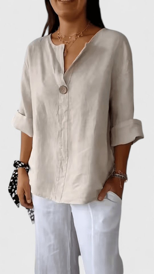 Comfortable women's V-neck knot blouse in a loose fit. Elegant fashion blouse for versatile everyday wear.