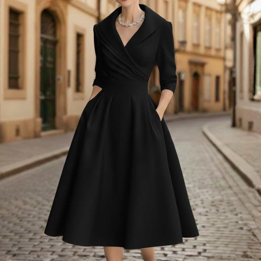 Classic women's V-neck midi dress with three-quarter sleeves, suitable for casual or dressy occasions.