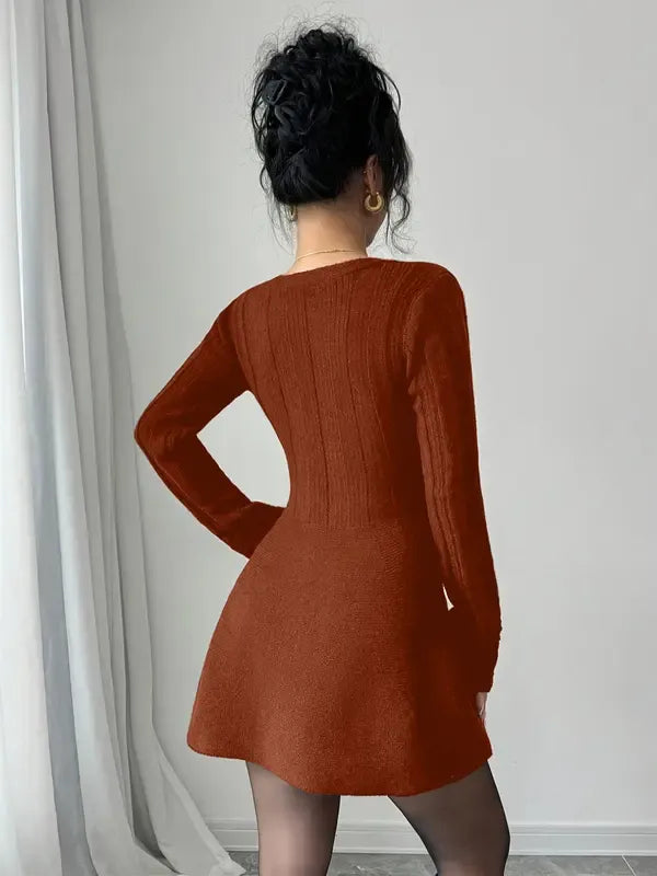 Fashionable women's V-neck mini dress with long sleeves, a flared skirt & button-front detail. Chic & versatile.