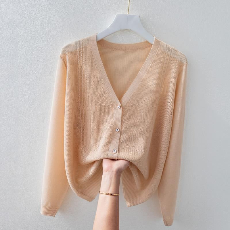 Versatile women's V-neck silk blend knit top. A soft, breathable button-up sweater, ideal for elegant everyday wear.
