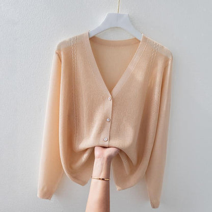 Versatile women's V-neck silk blend knit top. A soft, breathable button-up sweater, ideal for elegant everyday wear.