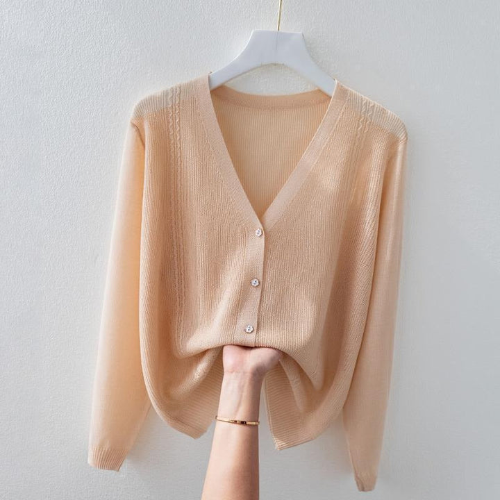 Versatile women's V-neck silk blend knit top. A soft, breathable button-up sweater, ideal for elegant everyday wear.