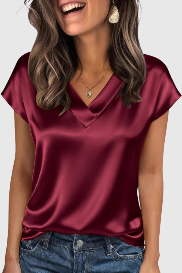 Chic women's short sleeve V-neck blouse, great for sophisticated office wear or stylish everyday looks.