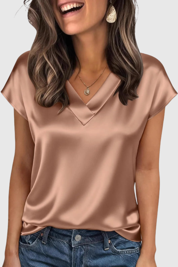 Effortless women's summer V-neck blouse, designed for breezy comfort and elegant style on warm days.