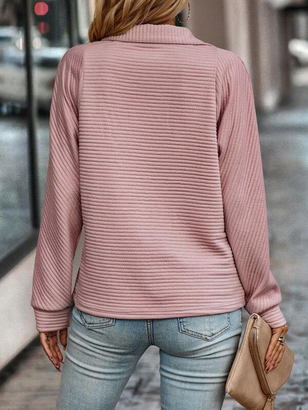 Versatile women's V-neck sweater, perfect for spring/summer comfort. Lightweight, elegant long sleeve knit.