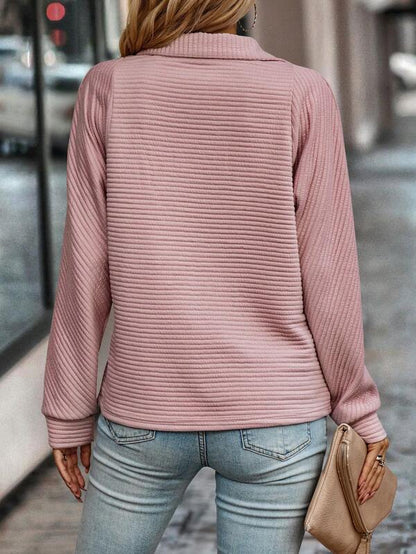 Versatile women's V-neck sweater, perfect for spring/summer comfort. Lightweight, elegant long sleeve knit.