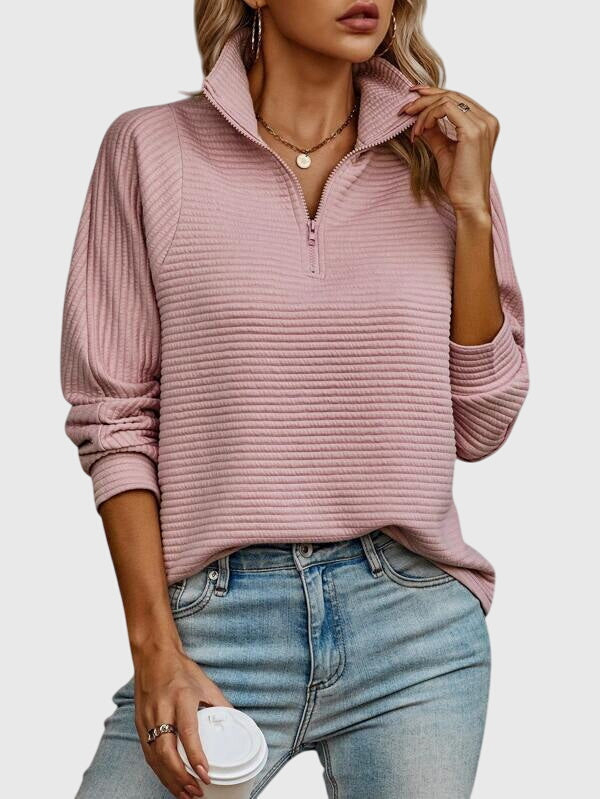 Casual chic women's elegant V-neck sweater with functional zipper. Ideal for modern women's fashion.