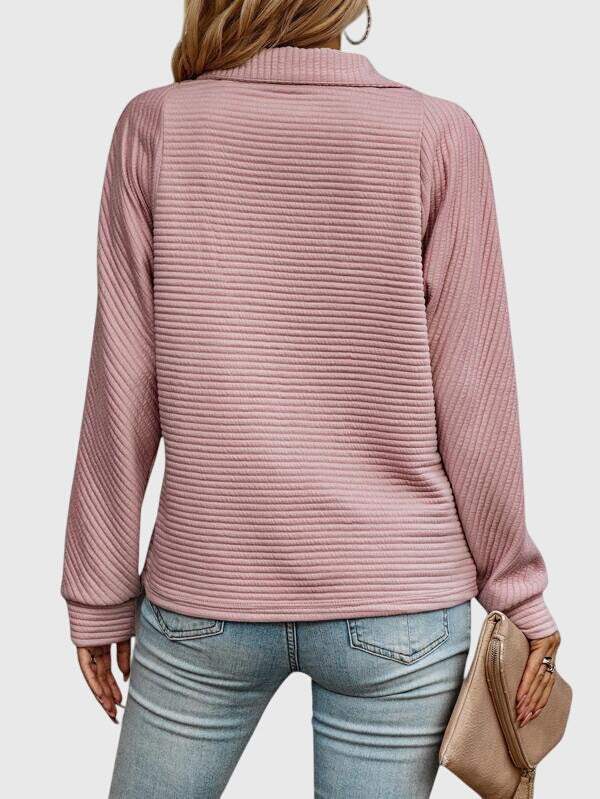 All-season women's long sleeve V-neck sweater featuring a sleek zipper. Comfortable and stylish piece.