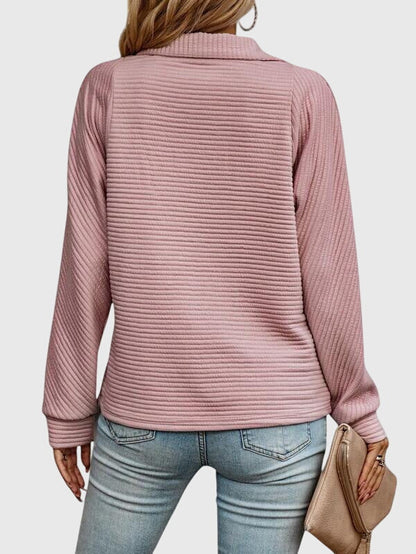 All-season women's long sleeve V-neck sweater featuring a sleek zipper. Comfortable and stylish piece.