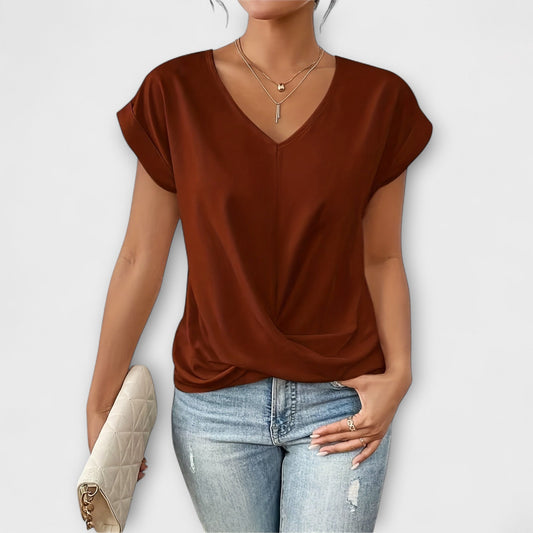 Elegant women's V-neck top with stylish button detail. Perfect for casual chic or sophisticated wear.