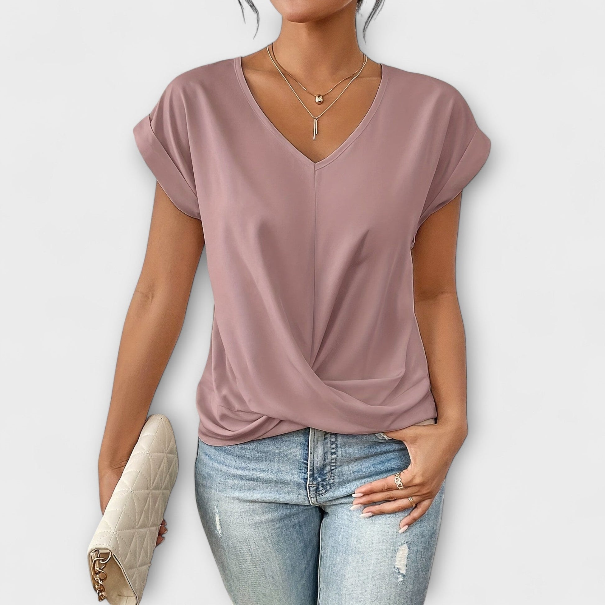 Comfortable long sleeve V-neck top for women, featuring elegant button detail. Ideal for everyday wear.