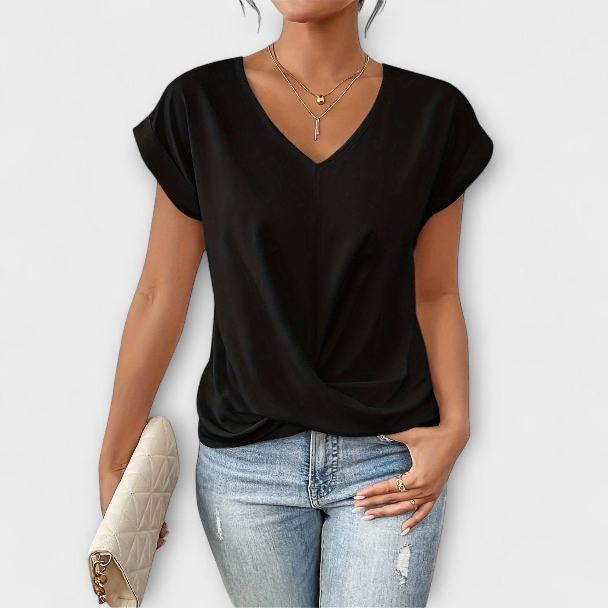 Versatile women's V-neck fashion blouse with sophisticated button accents. Great for ladies wear.