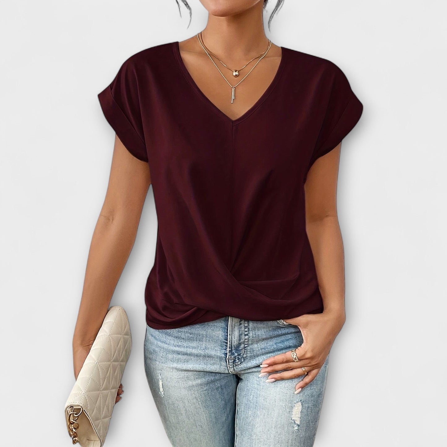 Stylish women's V-neck top, button detail. Achieve a casual chic look with this comfortable fashion blouse.
