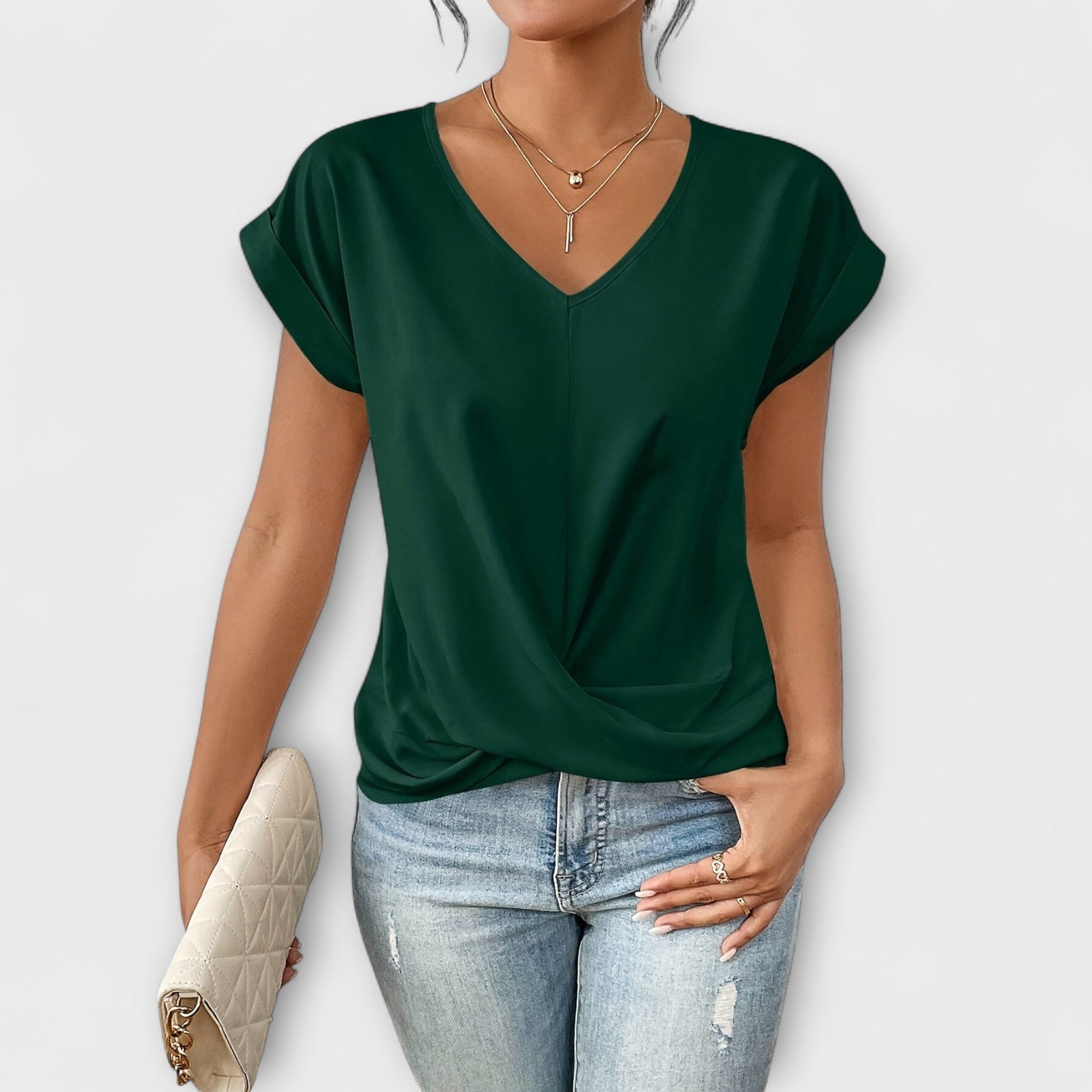 Sophisticated ladies V-neck top with elegant button details. A comfortable and stylish fashion blouse.