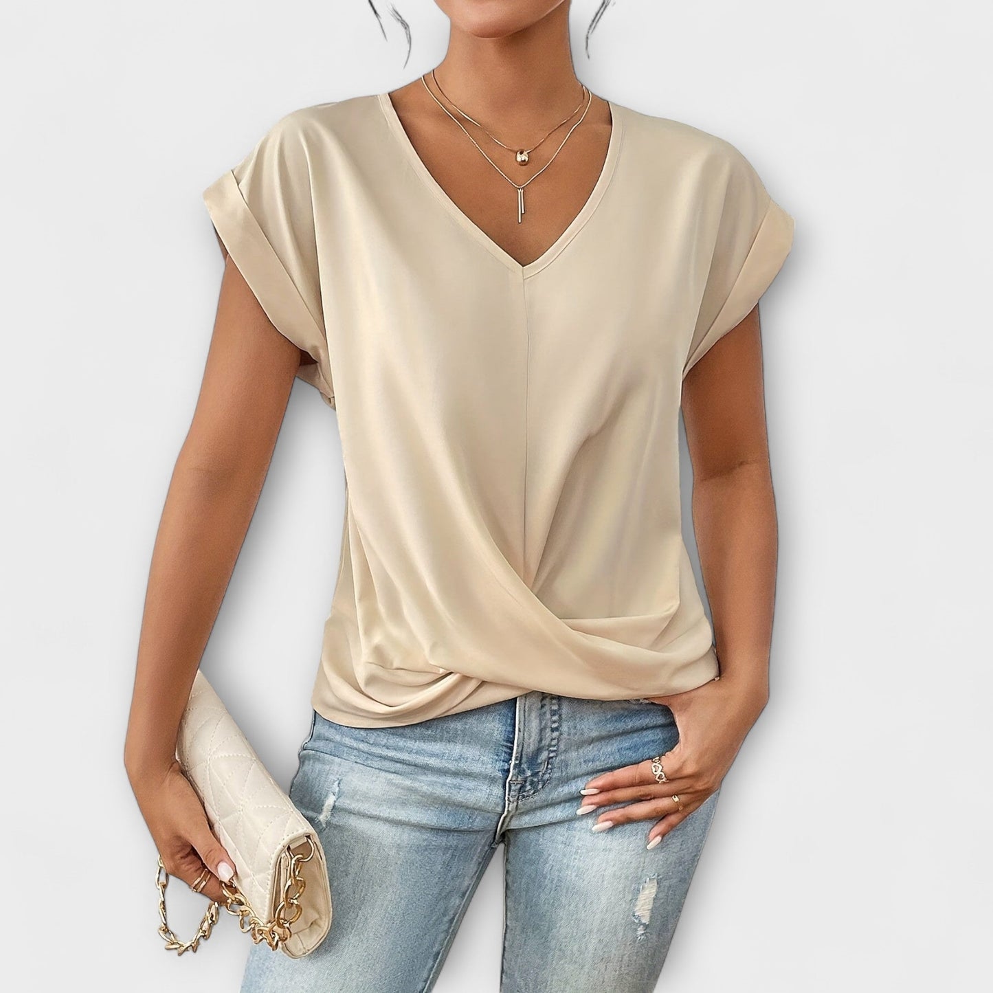 Stylish V-neck blouse for women with elegant button detail. Comfortable and perfect for everyday wear.