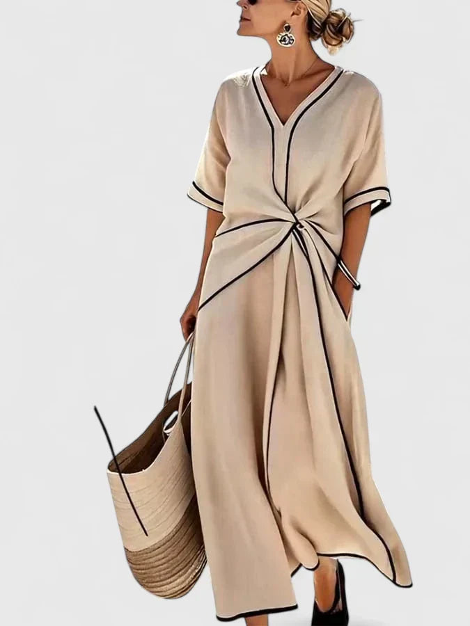 Elegant women's vertical stripe summer dress. Lightweight, flowy, and comfortable for warm weather or beach outings.