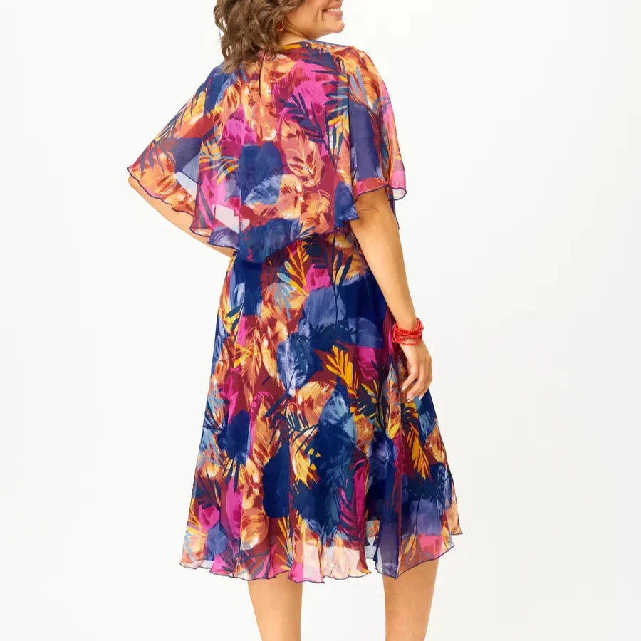 Comfortable long sleeve floral midi dress. Vibrant print & elegant flowy style, ideal for women's spring & summer fashion.