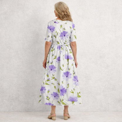Feminine floral maxi dress for women, featuring a vintage style and Peter Pan collar, ideal for spring outfits.