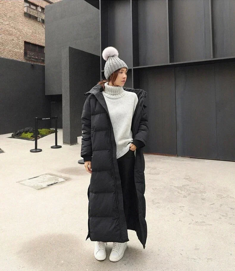 Warm women's quilted long winter coat. Elegant, windproof outerwear, ideal for cold weather & everyday style.