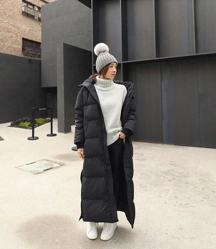 Warm women's quilted long winter coat. Elegant, windproof outerwear, ideal for cold weather & everyday style.