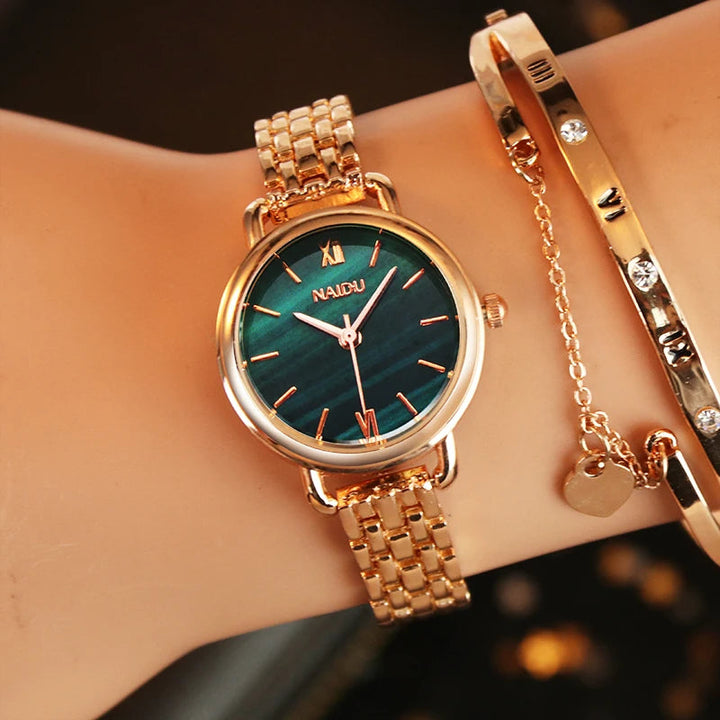 Rose gold women's watch, elegant marble dial, stainless steel, adjustable band.