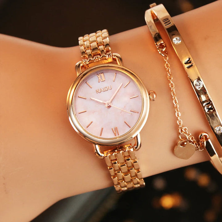 Silver women's watch, classic marble dial, stainless steel, a timeless fashion accessory.