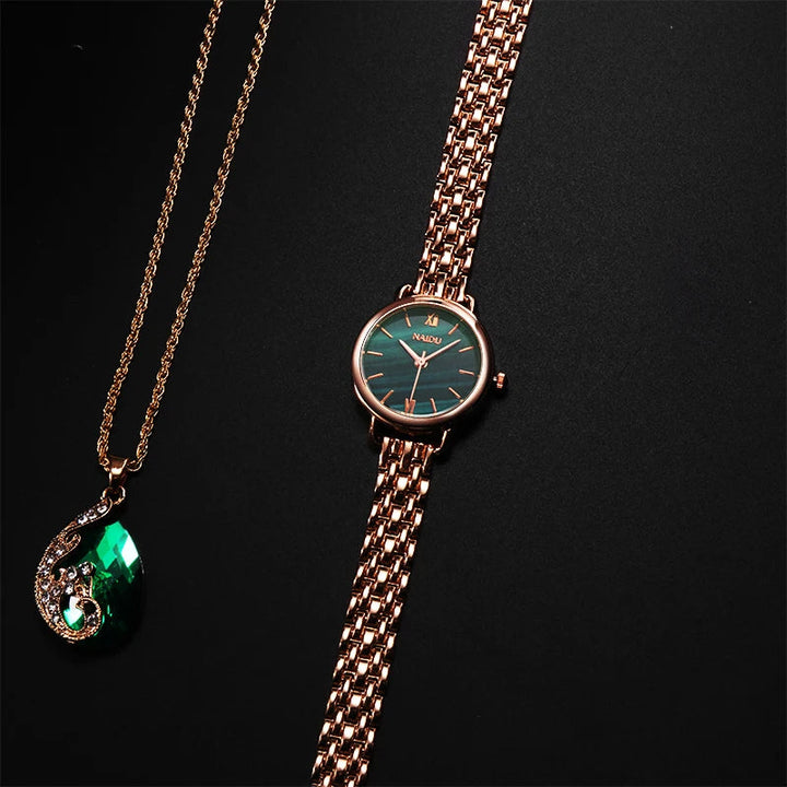 Close-up of elegant women's watch featuring a distinct marble dial & polished stainless steel case.